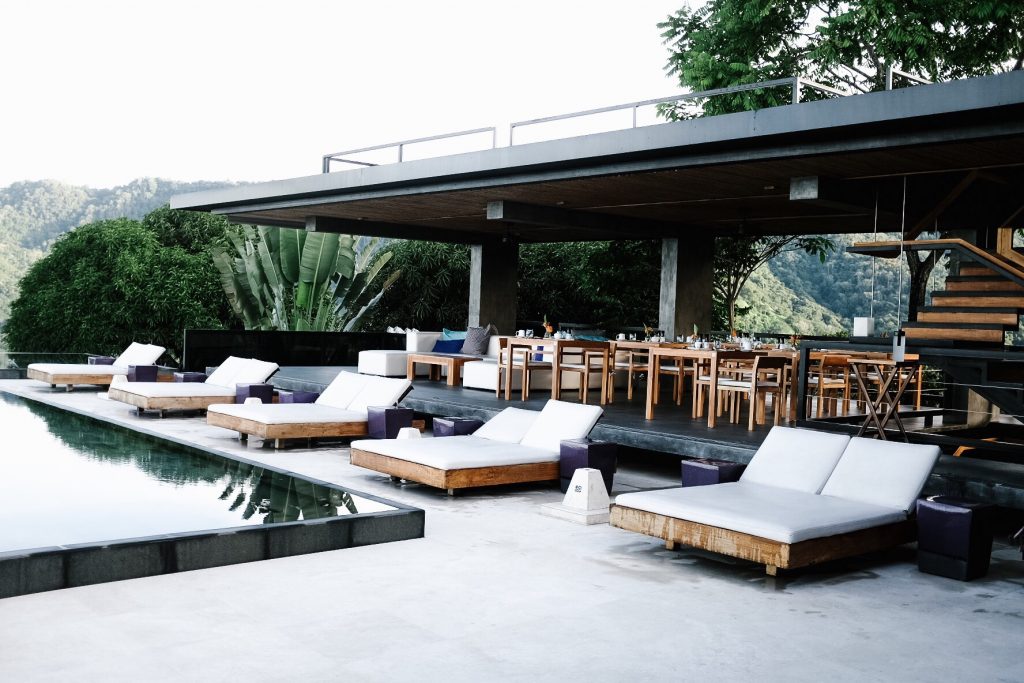 Costa Rica Featuring Kura Villas luxury modern boutique hotel infinity pool terrace H&M uvita quepos travel Charleston Fashion Blogger Dannon K. Collard Almost Happening lounge chairs teak white vinyl cushions rooftop