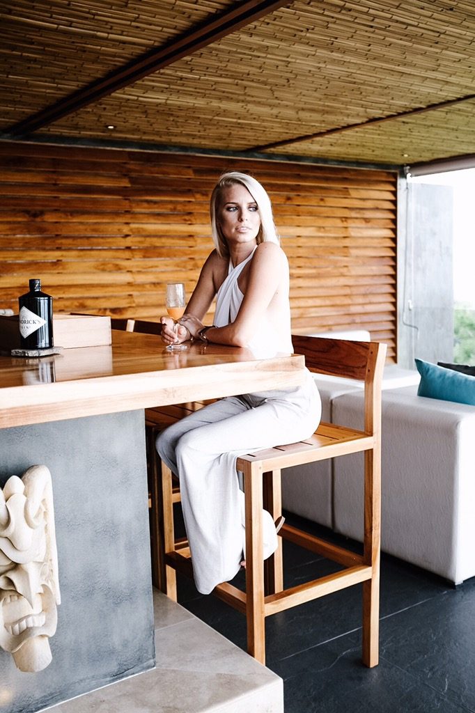 Costa Rica Featuring Kura Villas luxury modern boutique hotel infinity pool terrace H&M uvita quepos travel Charleston Fashion Blogger Dannon K. Collard Almost Happening white jumpsuit j brand grouses forever 21 criss-cross halter swimsuit one piece