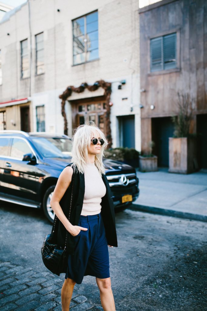 Boyish NYFW Street Style New York Fashion Week 2016 SS17 Street Style Fashion Trends Runway shaggy 70’s hair bangs women ribbed mock neck tank Abercrombie & Fitch Long satin bermuda shorts H&M Longline Black Vest Loafers Forever 21 // Charleston Fashion Blogger Dannon Almost Happening 