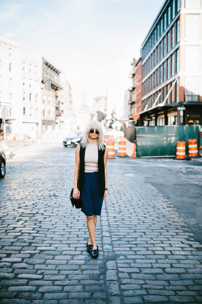 Boyish NYFW Street Style New York Fashion Week 2016 SS17 Street Style Fashion Trends Runway shaggy 70’s hair bangs women ribbed mock neck tank Abercrombie & Fitch Long satin bermuda shorts H&M Longline Black Vest Loafers Forever 21 // Charleston Fashion Blogger Dannon Almost Happening