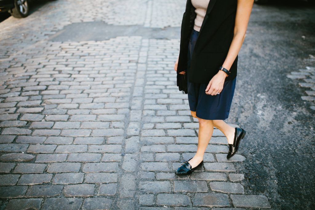 Boyish NYFW Street Style New York Fashion Week 2016 SS17 Street Style Fashion Trends Runway shaggy 70’s hair bangs women ribbed mock neck tank Abercrombie & Fitch Long satin bermuda shorts H&M Longline Black Vest Loafers Forever 21 // Charleston Fashion Blogger Dannon Almost Happening