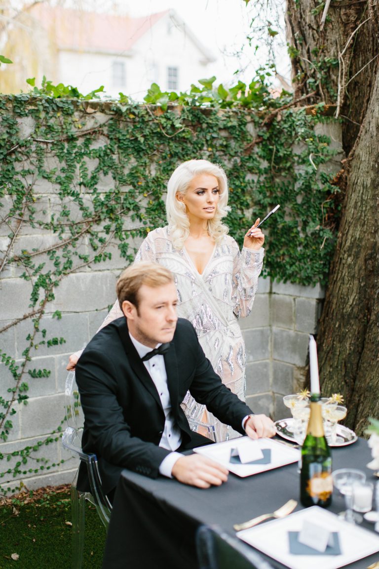 1920's New Years Party Charleston roaring twenties champagne tower great gatsby decor black white gold blush tablescape display black tie Charleston Fashion Blogger Dannon Almost Happening