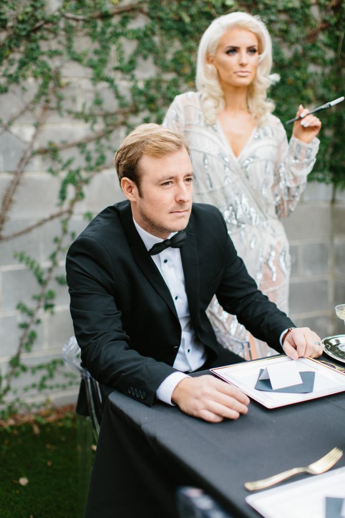 1920's New Years Party Charleston roaring twenties champagne tower great gatsby decor black white gold blush tablescape display black tie Charleston Fashion Blogger Dannon Almost Happening