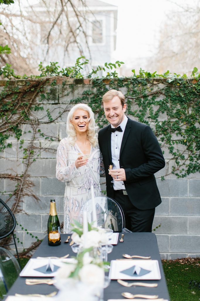 1920's New Years Party Charleston roaring twenties champagne tower great gatsby decor black white gold blush tablescape display black tie Charleston Fashion Blogger Dannon Almost Happening