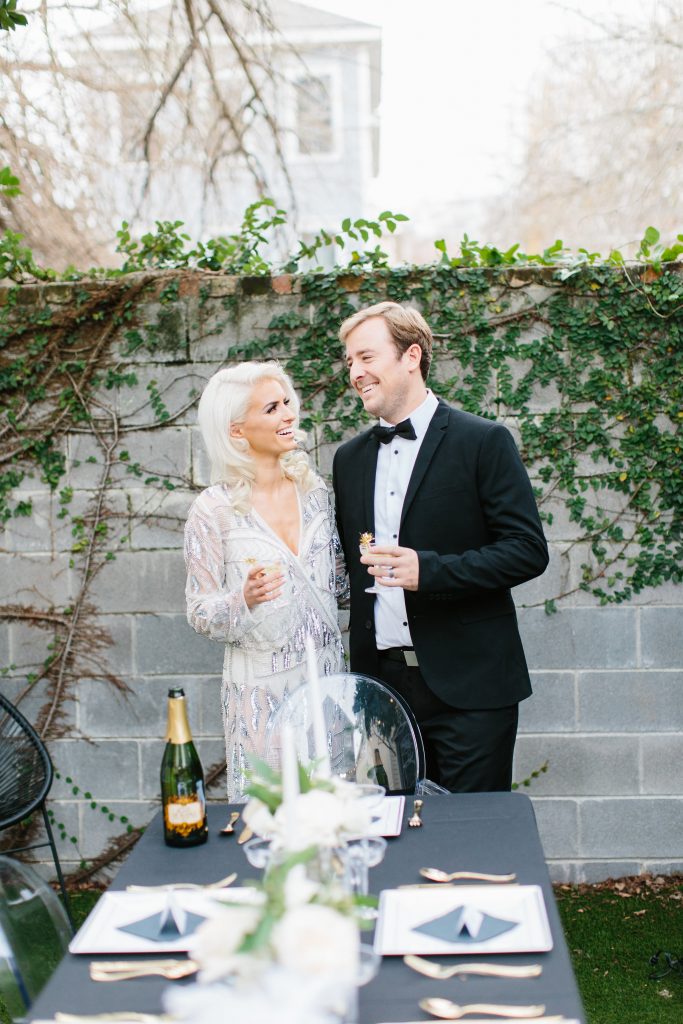 1920's New Years Party Charleston roaring twenties champagne tower great gatsby decor black white gold blush tablescape display black tie Charleston Fashion Blogger Dannon Almost Happening