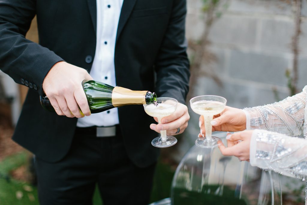 1920's New Years Party Charleston roaring twenties champagne tower great gatsby decor black white gold blush tablescape display black tie Charleston Fashion Blogger Dannon Almost Happening