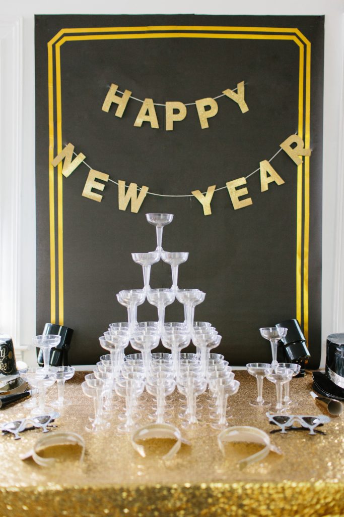 1920's New Years Party Charleston roaring twenties champagne tower great gatsby decor black white gold blush tablescape display black tie Charleston Fashion Blogger Dannon Almost Happening