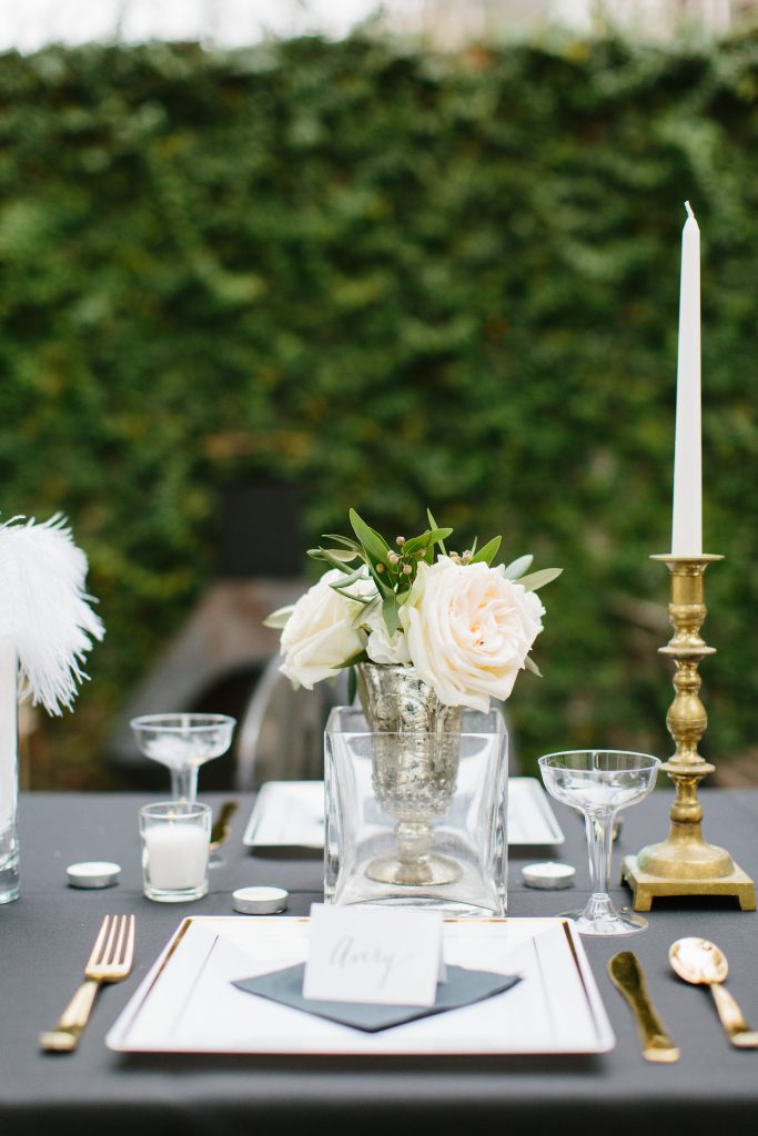 1920's New Years Party Charleston roaring twenties champagne tower great gatsby decor black white gold blush tablescape display black tie Charleston Fashion Blogger Dannon Almost Happening