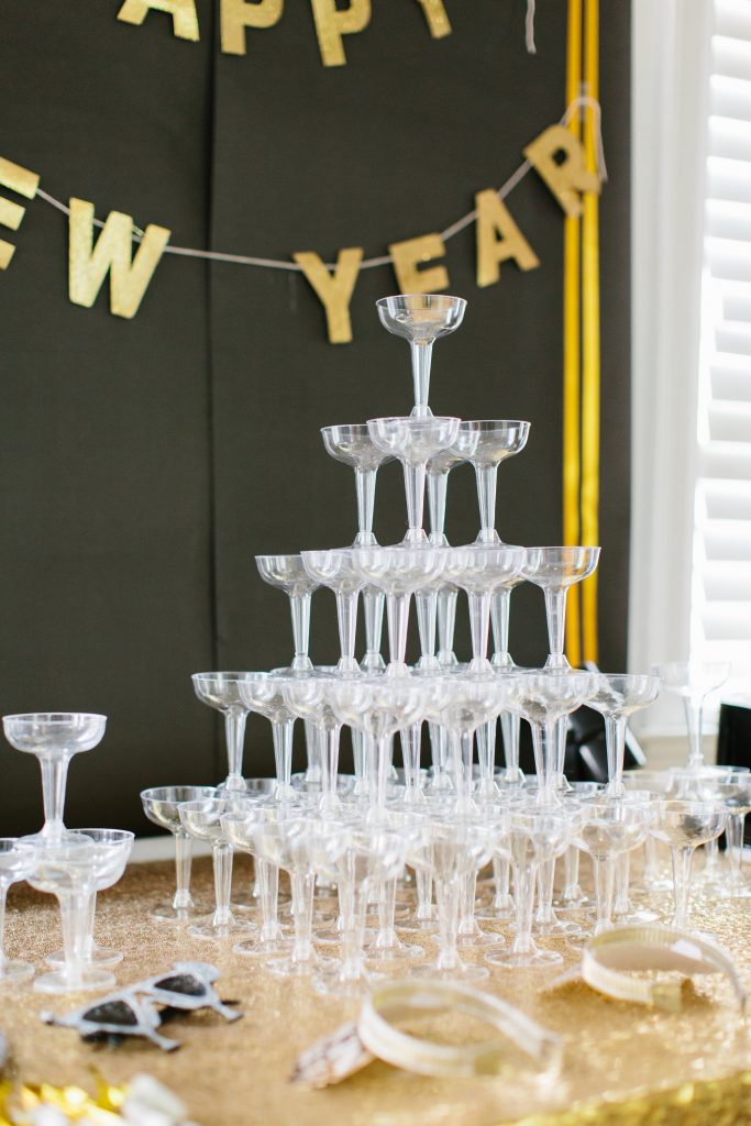 1920's New Years Party Charleston roaring twenties champagne tower great gatsby decor black white gold blush tablescape display black tie Charleston Fashion Blogger Dannon Almost Happening
