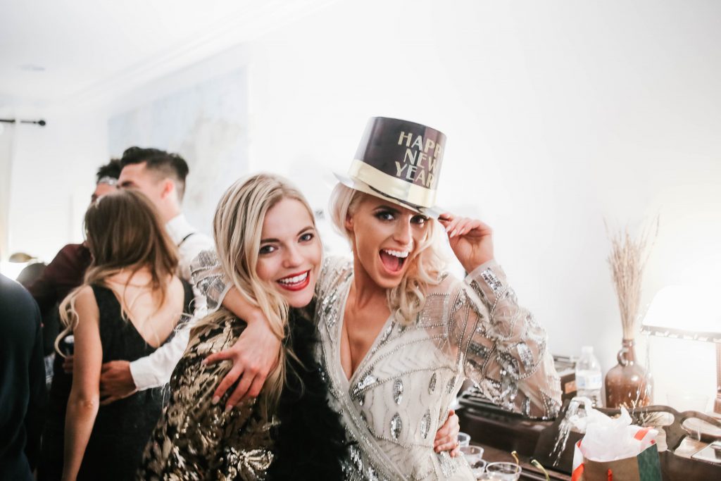 1920's New Years Party Charleston roaring twenties champagne tower great gatsby decor black white gold blush tablescape display black tie Charleston Fashion Blogger Dannon Almost Happening