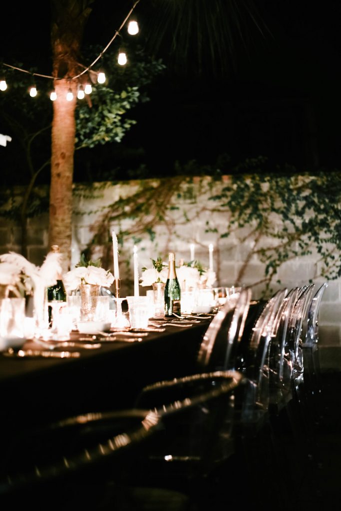 1920's New Years Party Charleston roaring twenties champagne tower great gatsby decor black white gold blush tablescape display black tie Charleston Fashion Blogger Dannon Almost Happening outdoor dinner