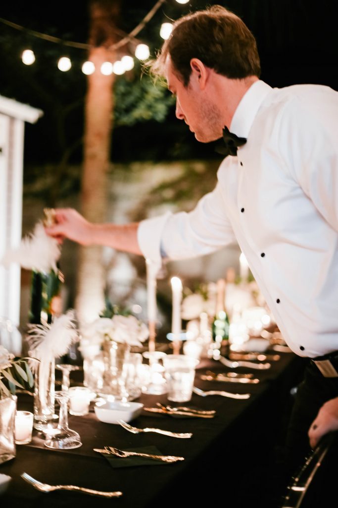 1920's New Years Party Charleston roaring twenties champagne tower great gatsby decor black white gold blush tablescape display black tie Charleston Fashion Blogger Dannon Almost Happening outdoor dinner