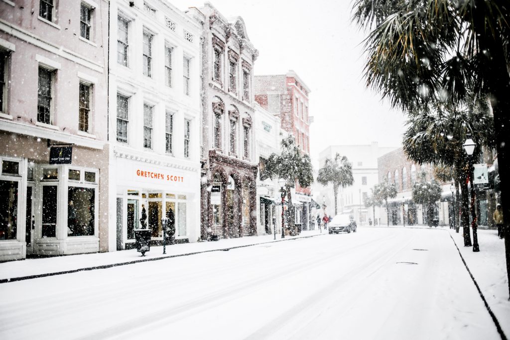 Snow in Charleston SC king street January 4th 2018 white skinny jeans gray wool long coat forever 21 black ankle boots beanie gray knit sweater turtleneck Charleston Fashion Blogger Dannon Almost Happening